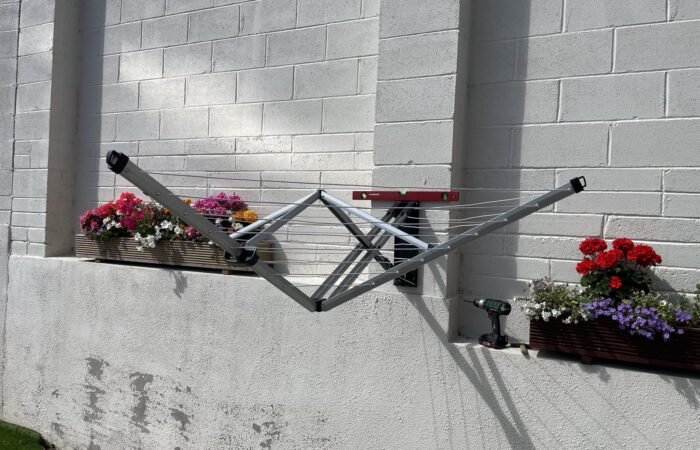 Wall-mounted clothes airer installed on an outside wall