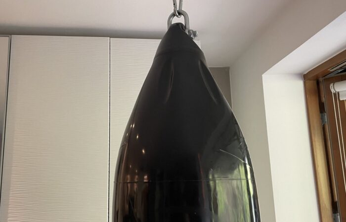 Heavy punching bag mounted to a ceiling