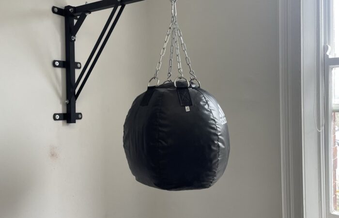 Punching bag mounted on a wall bracket