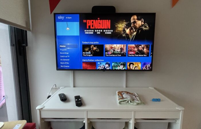 43-inch TV with Sky TV set up, wall mounted in a children's room