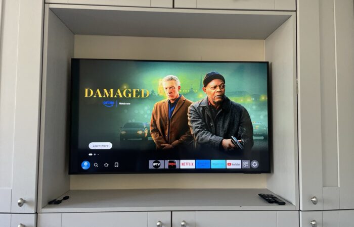 50-inch TV wall mounted inside a fitted furniture alcove